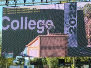 college graduation captions overlaid onto large projected screen